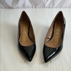 Calvin Klein Black Patent Pointed Toe Pumps with Gold Logo Accent